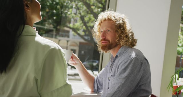 Casual Business Meeting in Modern Urban Cafe with Natural Light - Download Free Stock Images Pikwizard.com