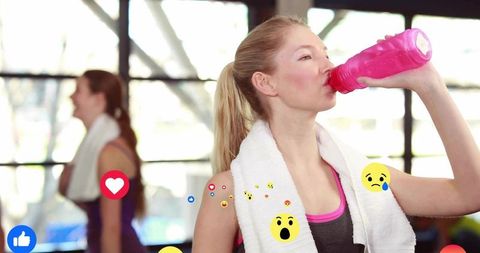 Active Athlete Hydrating After Workout in Gym with Emojis Overlay
