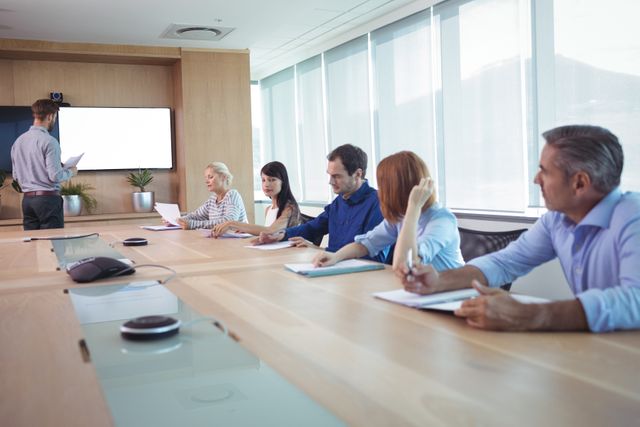 Business people at conference table in board room during meeting