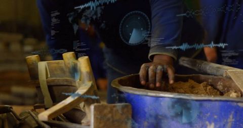 Craftsman's Hands Mixing Clay in Artisan Workshop