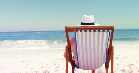 Relaxing on Beach Chair Enjoying Serene Ocean View - Download Free Stock Images Pikwizard.com