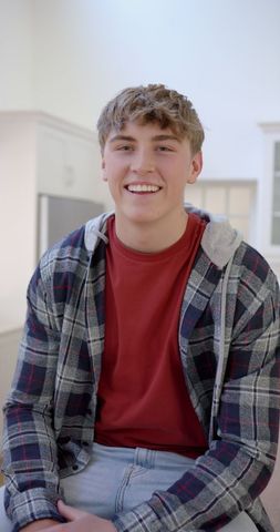 Smiling Teen Boy in Modern Home Interior - Download Free Stock Images Pikwizard.com