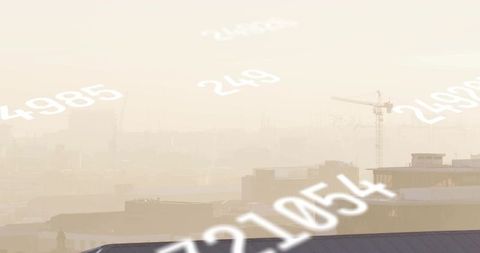 Hazy urban skyline showing numeric overlays, construction cranes, silhouettes, muted tones