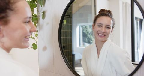 Woman Embracing Self-Care in Calm Bathroom Environment