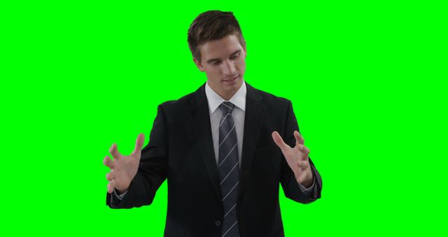 Businessman in Suit Giving Presentation with Green Screen Background - Download Free Stock Images Pikwizard.com