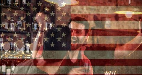 Joyful Friends Cheering in Sports Bar with USA Flag Overlay