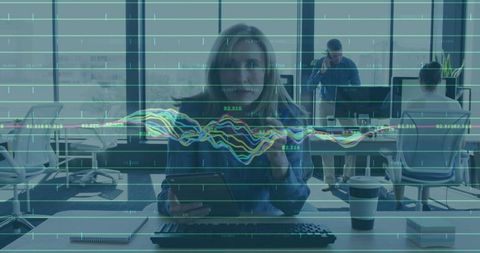 Female Professional Analyzing Charts in Modern Office Environment