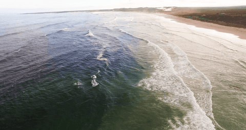 transparent ocean waves gently crashing on serene beach shoreline - Download Free Stock Videos Pikwizard.com