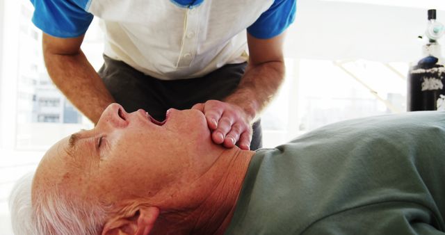 Doctor performing necessary medical check on senior man in modern clinic - Download Free Stock Images Pikwizard.com