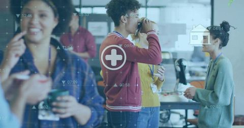 Coworkers chatting and drinking coffee in modern open-plan office with HUD data overlay