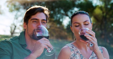 Couple Enjoying Wine Outdoors in Bright Sunshine