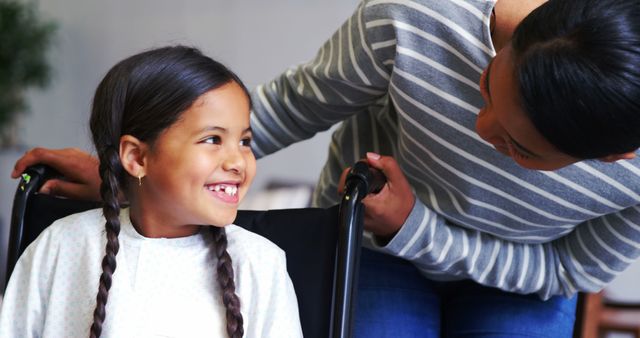 Mother Bonding with Daughter in Wheelchair Showing Love and Support - Download Free Stock Images Pikwizard.com