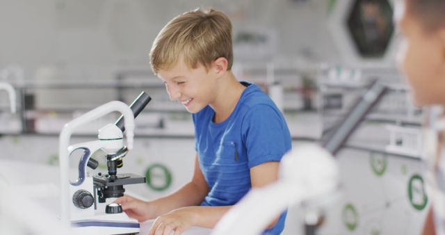 Young Boy Exploring Microscope in Science Classroom - Download Free Stock Images Pikwizard.com