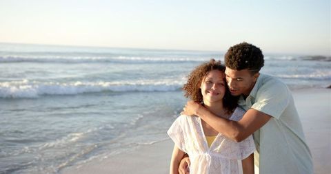 Interracial Couple Enjoying Romantic Beach Sunset - Download Free Stock Images Pikwizard.com