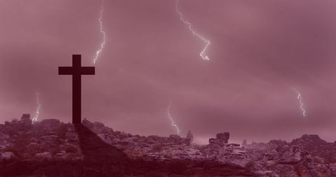 Dramatic Cross Silhouette Under Striking Lightning