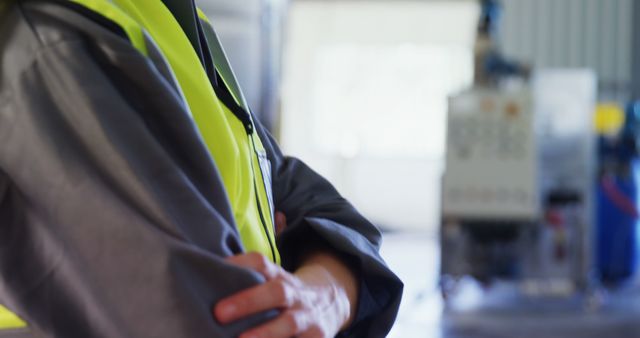 Factory Worker Standing in Industrial Facility with Crossed Arms - Download Free Stock Images Pikwizard.com