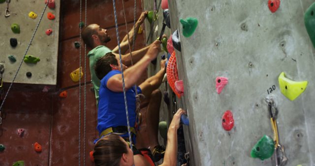 Group of Friends Enjoying Indoor Rock Climbing Together - Download Free Stock Images Pikwizard.com