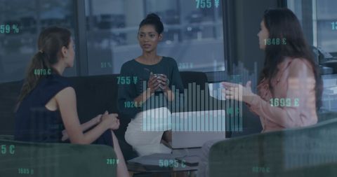 Women Analyzing Economic Data in Modern Office