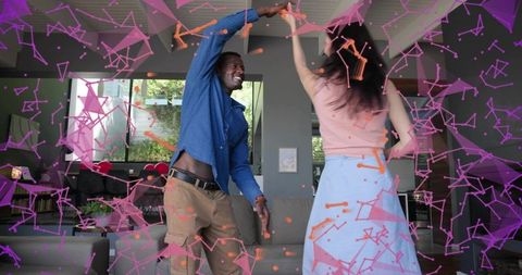 Couple dancing and twirling in modern living room with augmented reality overlay