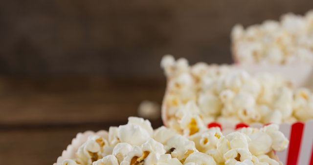 Fresh Popcorn in Striped Boxes on Rustic Wooden Table - Download Free Stock Images Pikwizard.com