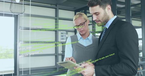 Business Professionals Analyzing Data Technology in Modern Office