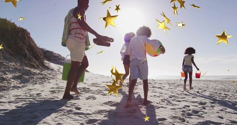 Joyful Family Vacation on Sandy Beach with Playful Beach Ball and Stars - Download Free Stock Images Pikwizard.com