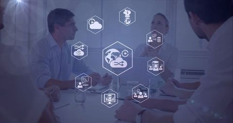 Businesspeople discussing global networking and technology innovations