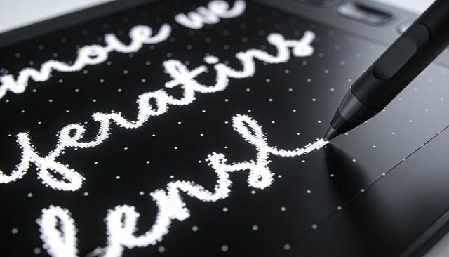 Digital stylus drawing dotted cursive on tablet for creative lettering and UI design