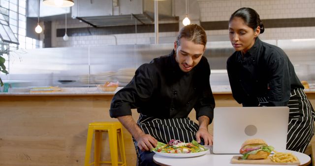 Culinary Team Preparing and Reviewing Dishes in Modern Restaurant Kitchen - Download Free Stock Images Pikwizard.com