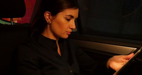 Businesswoman Engaged with Digital Tablet in Night Journey - Download Free Stock Images Pikwizard.com