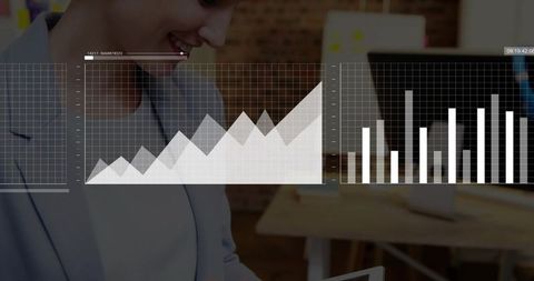 Businesswoman reviewing tablet with data charts overlay in open-plan office