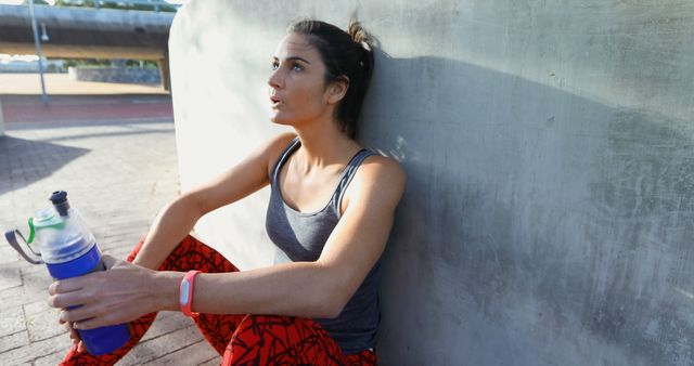 Exhausted Woman Resting After Outdoor Run with Water Bottle - Download Free Stock Images Pikwizard.com