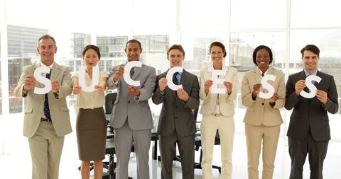 Team Celebrating Success in Bright Office Environment