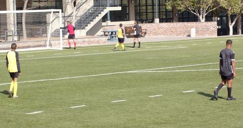 Soccer Players Practicing on Field During Daytime Training
