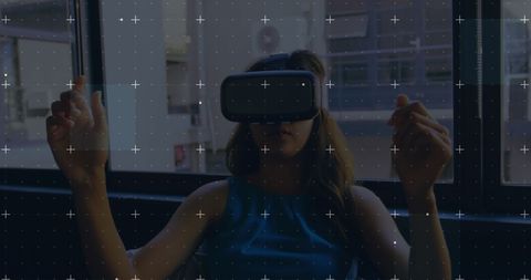 Woman Engaged with Virtual Reality Technology Indoors