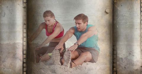 Couple stretching on sandy beach with vintage filmstrip effect for fitness and training
