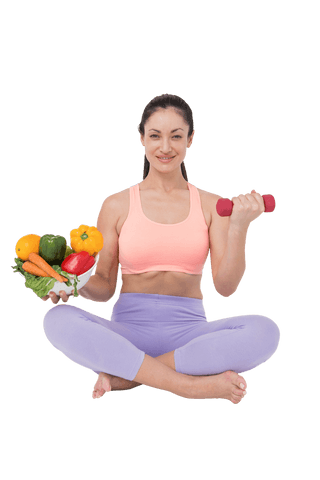 brunette woman sitting cross-legged holding transparent dumbbell and vegetables - Download Free Stock Videos Pikwizard.com