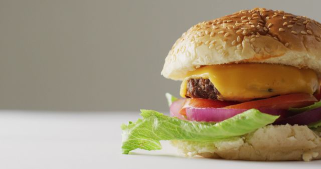 Close-Up of Delicious Cheeseburger with Fresh Vegetables - Download Free Stock Images Pikwizard.com