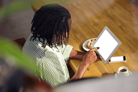 High Angle View of Man Using Tablet at Cafe with Coffee - Download Free Stock Videos Pikwizard.com