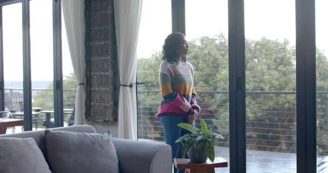 Woman Standing by Window Looking Outside - Download Free Stock Images Pikwizard.com