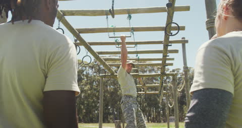 Military Trainer Demonstrating Obstacle Course Techniques