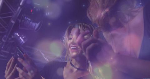 Friends Enjoying Nightlife with Smartphone in Vibrant Club