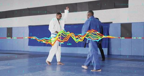 Judo sparring athletes wearing white and blue gis with biometric waveform overlay