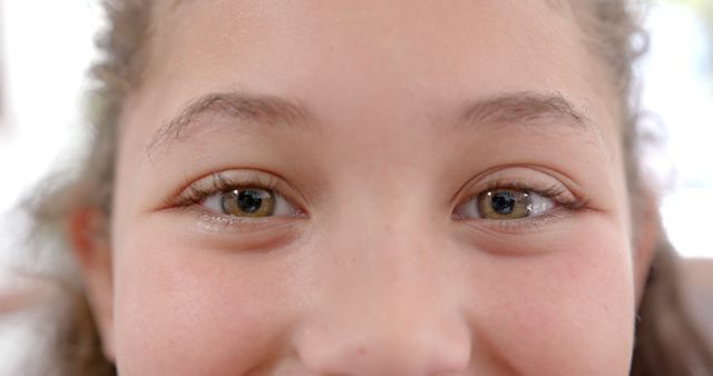 Close-Up of a Smiling Girl's Eyes with Natural Hazelnut Color - Download Free Stock Images Pikwizard.com