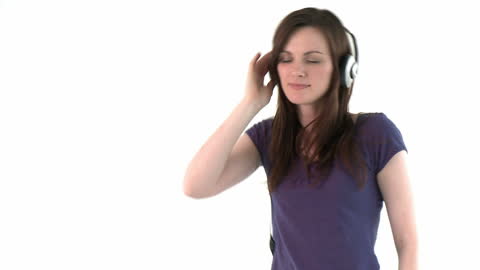 Woman Smiling While Enjoying Music with Headphones on White Background