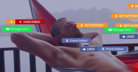 Shirtless man relaxing in hammock on waterfront balcony with social media notifications