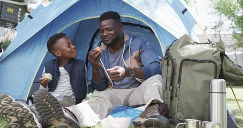 Father and Son Bonding During Outdoor Camping Adventure
