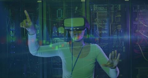 IT specialist using VR headset in data center interacting with holographic analytics