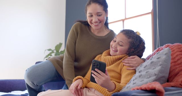 Mother and Daughter Enjoying Time Together On Phone at Home - Download Free Stock Images Pikwizard.com