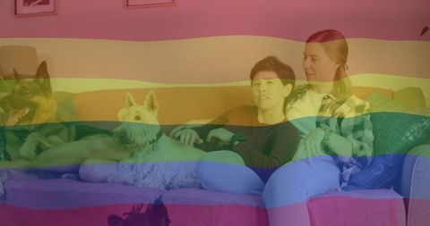 Loving Lesbian Couple Relaxing on Couch with Dogs Pride Flag Overlay - Download Free Stock Images Pikwizard.com